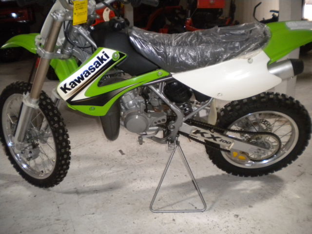 03 kx100